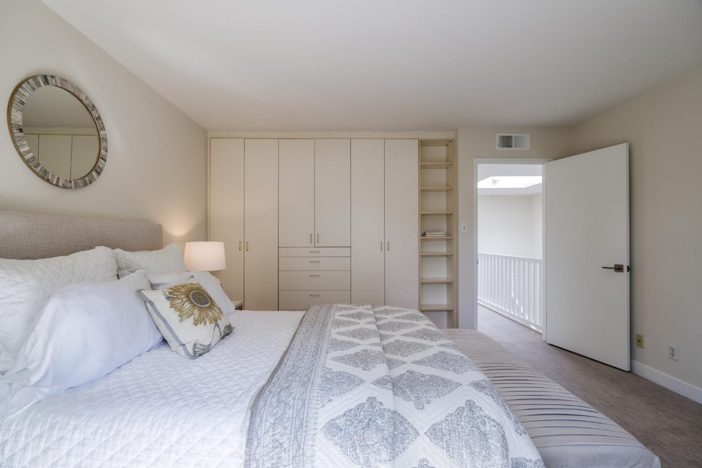 2313 Sharon Road Menlo Park, CA 94025 - Photo 18 of 29 a bedroom with a bed and a mirror