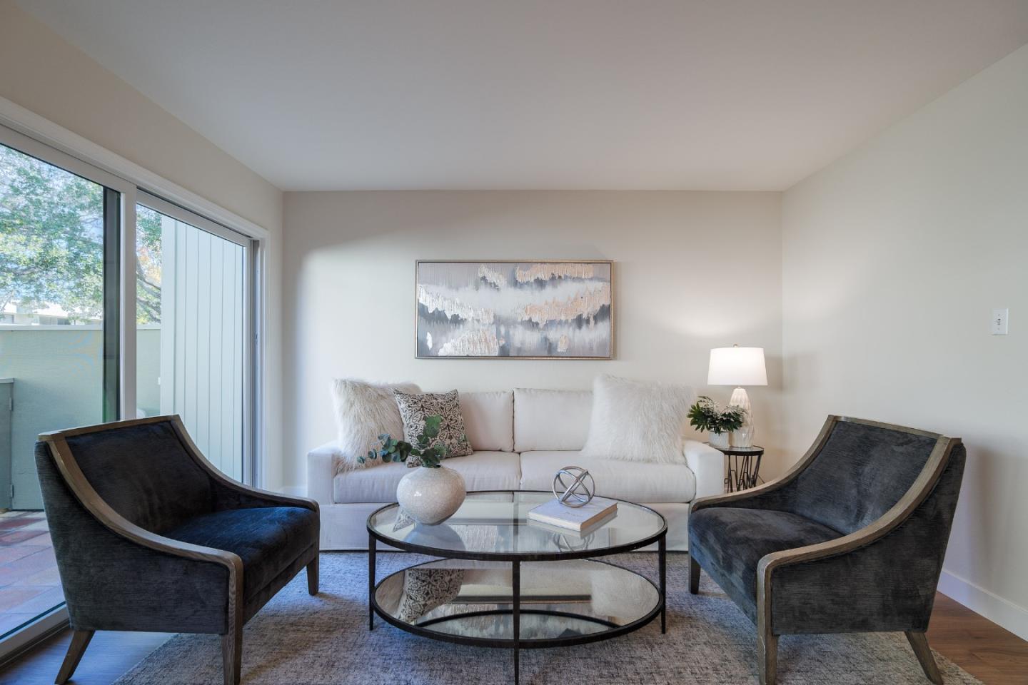 2313 Sharon Road Menlo Park, CA 94025 - Photo 8 of 29 a living room with furniture a lamp and a large window