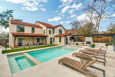 a view of house with swimming pool yard and outdoor seating