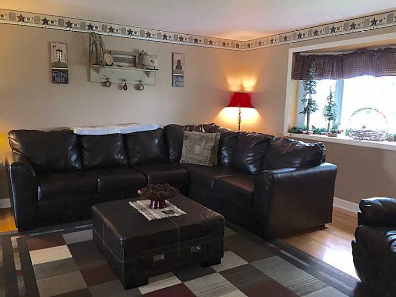 939 Linden Road Eighty Four, PA 15330 - Photo 2 of 24 Living Room. Living room with hardwood floors, large window, neutral walls