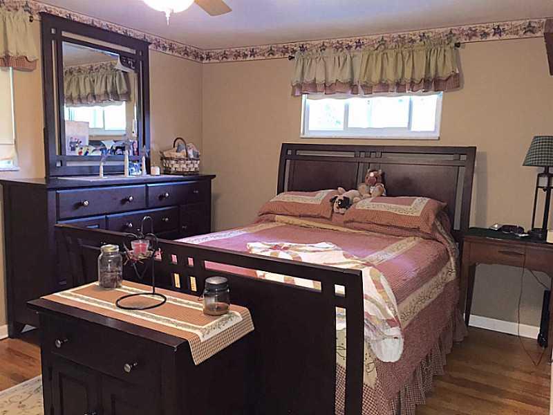 939 Linden Road Eighty Four, PA 15330 - Photo 13 of 24 Master Bedroom. Master on main level with hardwood floors, ceiling fan with light