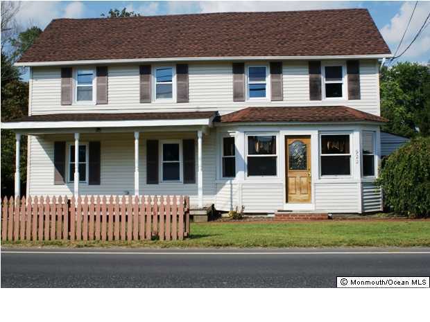922 Adelphia Road Freehold, NJ 07728 - Photo 1 of 3 a front view of a house with a yard