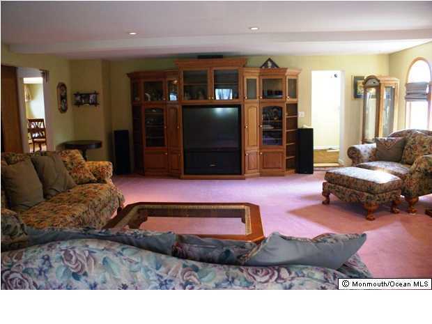 922 Adelphia Road Freehold, NJ 07728 - Photo 3 of 3 a living room with furniture and a flat screen tv