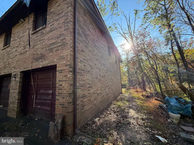 a brick building with a yard