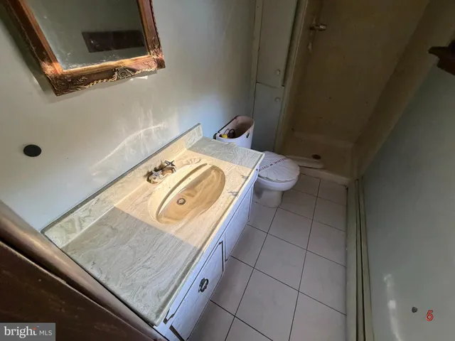 a bathroom with a sink and toilet