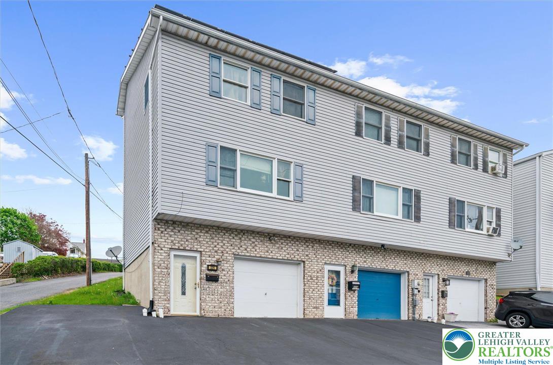 326 Chestnut Street Slatington, PA 18080 - Photo 3 of 28 a front view of a house with a yard