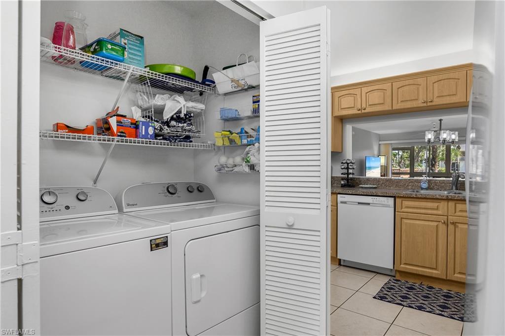 1330 Yesica Ann Circle, Unit I106 Naples, FL 34110 - Photo 12 of 38 a utility room with dryer and washer
