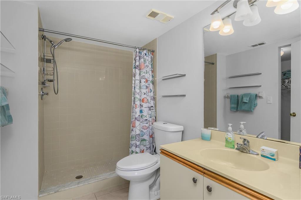 1330 Yesica Ann Circle, Unit I106 Naples, FL 34110 - Photo 18 of 38 a bathroom with a sink toilet and shower