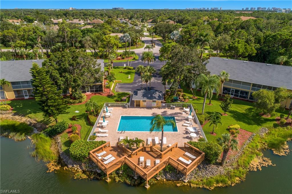 1330 Yesica Ann Circle, Unit I106 Naples, FL 34110 - Photo 23 of 38 an aerial view of residential houses with outdoor space