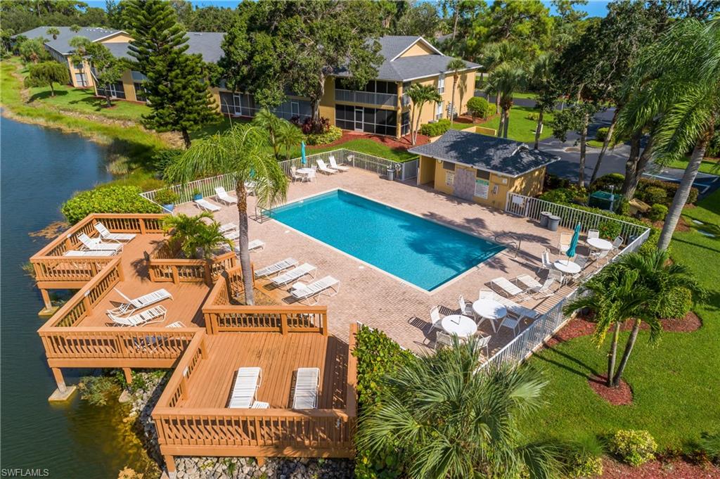 1330 Yesica Ann Circle, Unit I106 Naples, FL 34110 - Photo 24 of 38 an aerial view of a house with a yard