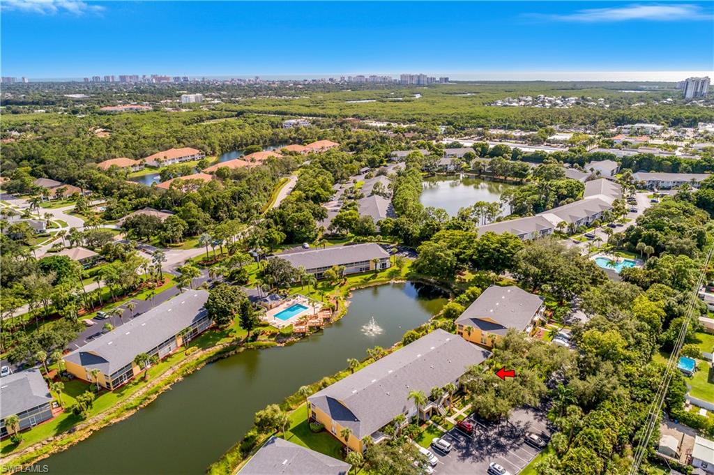 1330 Yesica Ann Circle, Unit I106 Naples, FL 34110 - Photo 35 of 38 an aerial view of residential houses with outdoor space
