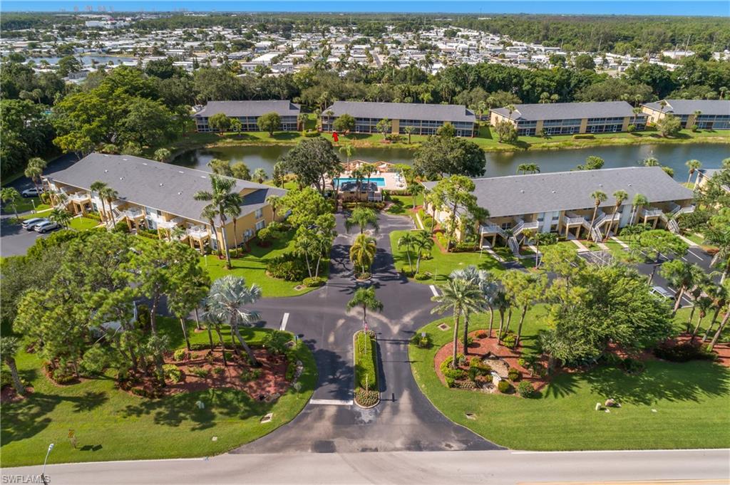 1330 Yesica Ann Circle, Unit I106 Naples, FL 34110 - Photo 36 of 38 an aerial view of a residential houses with outdoor space and swimming pool