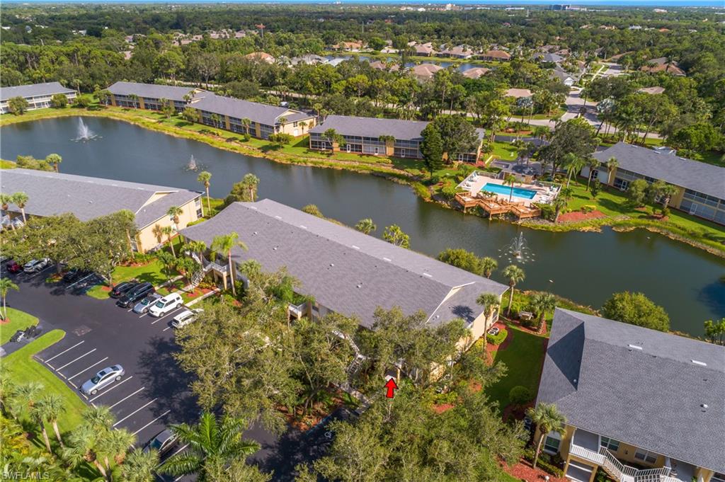 1330 Yesica Ann Circle, Unit I106 Naples, FL 34110 - Photo 37 of 38 an aerial view of a houses with a lake view