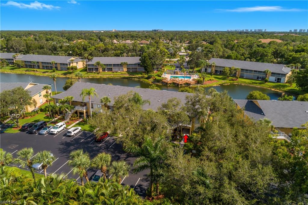 1330 Yesica Ann Circle, Unit I106 Naples, FL 34110 - Photo 38 of 38 an aerial view of residential houses with outdoor space
