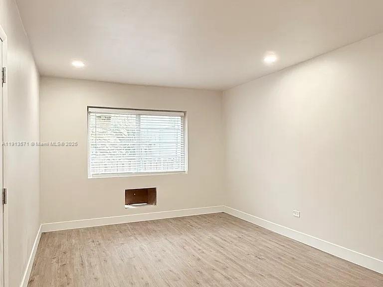 1537 Jefferson Avenue, Unit 3 Miami Beach, FL 33139 - Photo 6 of 10 an empty room with a window