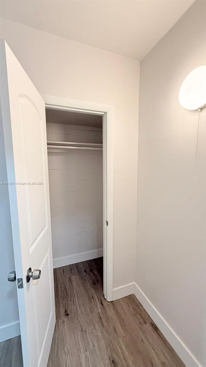 1537 Jefferson Avenue, Unit 3 Miami Beach, FL 33139 - Photo 8 of 10 an empty room with wooden floor and entrance