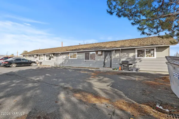 a view of a house with a street