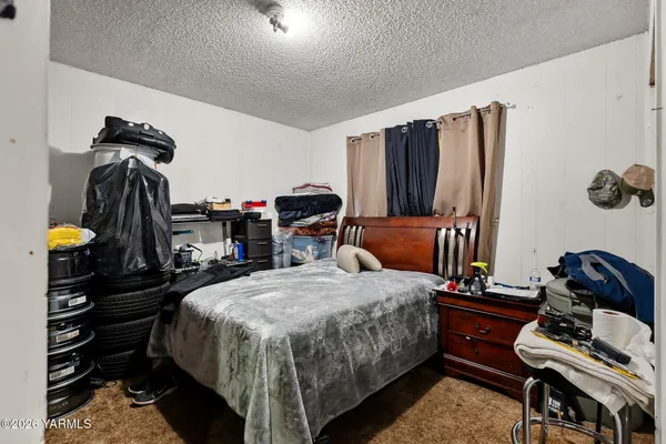 a bedroom with bed and a closet