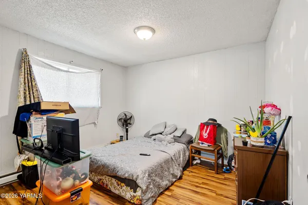 a bedroom with a bed and a tv in it