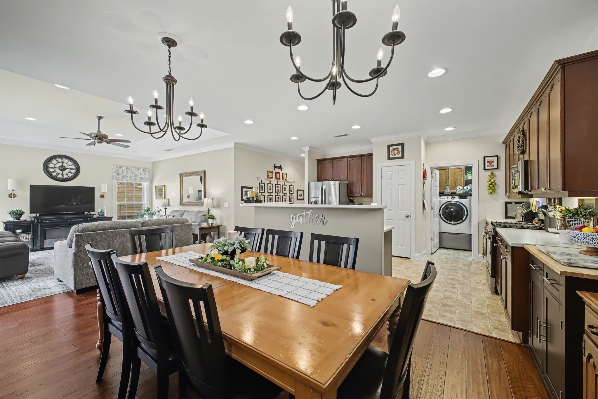213 Lilac Circle Franklin, TN 37064 - Photo 11 of 33 a view of a dining room with furniture a kitchen and chandelier