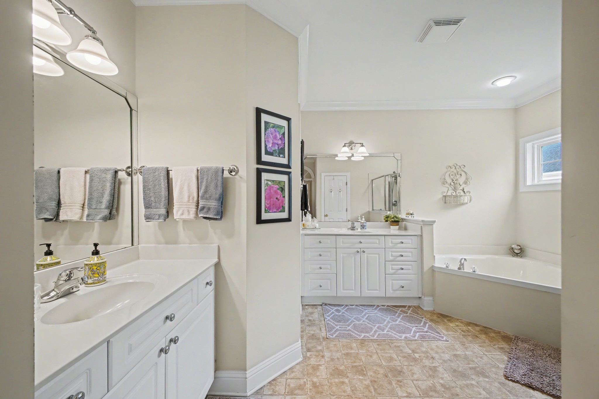 213 Lilac Circle Franklin, TN 37064 - Photo 18 of 33 a bathroom with a sink vanity tub shower and a mirror