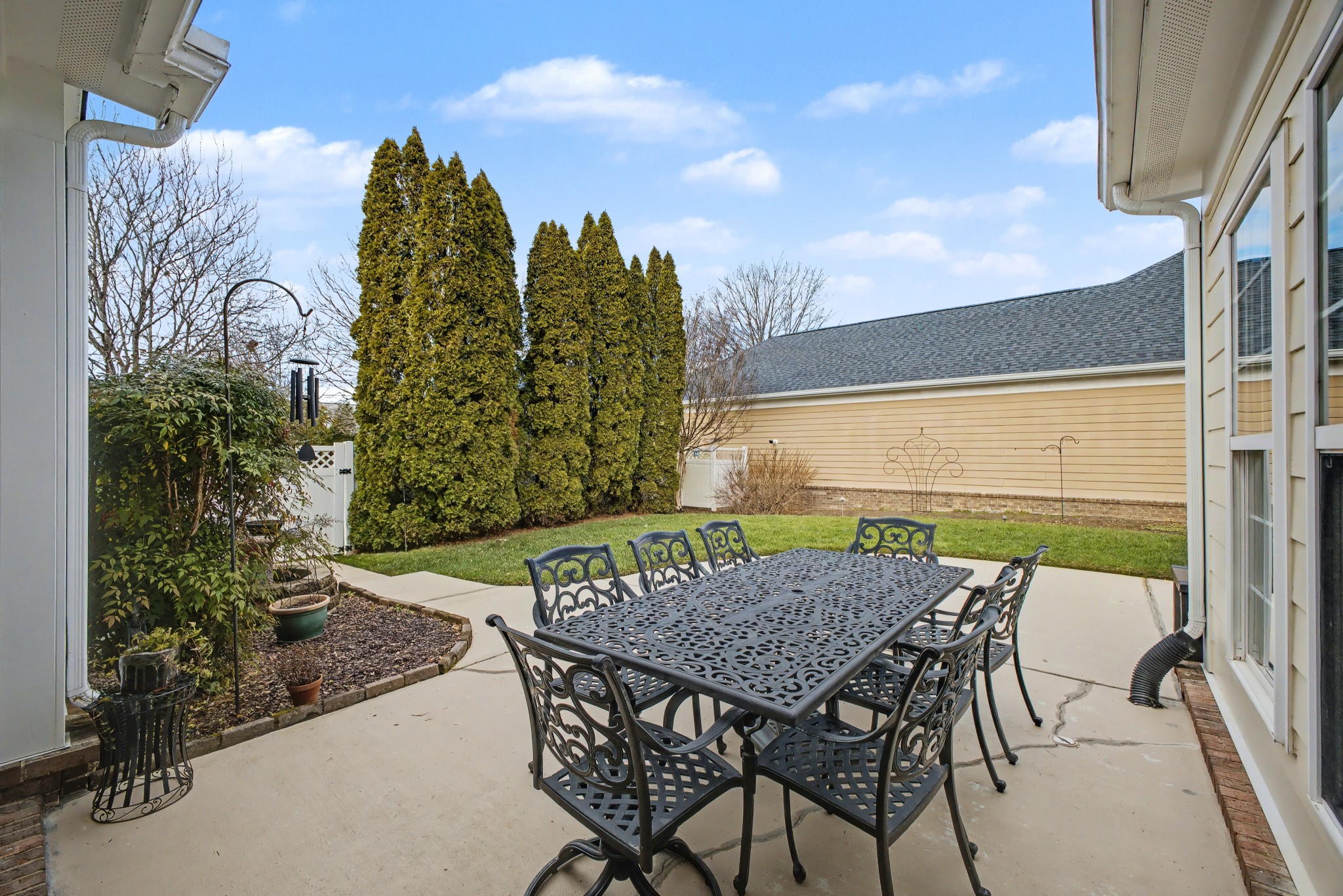 213 Lilac Circle Franklin, TN 37064 - Photo 30 of 33 a view of a patio with table and chairs and potted plants