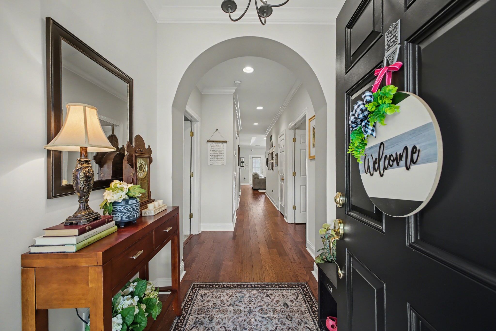 213 Lilac Circle Franklin, TN 37064 - Photo 5 of 33 a view of a hallway with wooden floor and a potted plant