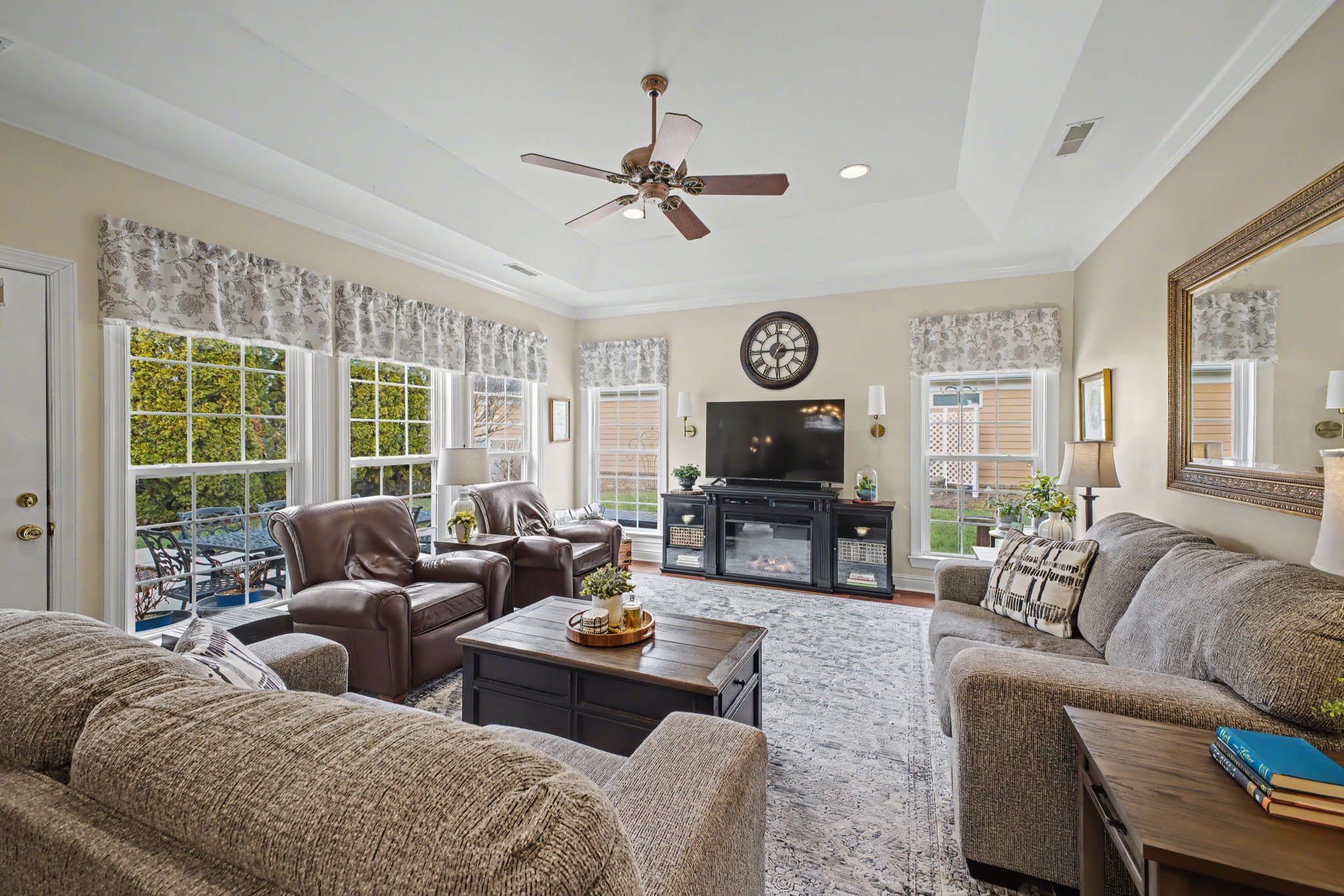 213 Lilac Circle Franklin, TN 37064 - Photo 7 of 33 a living room with furniture a large window and a clock