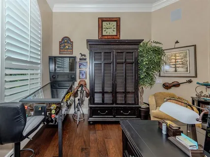a bathroom with a granite countertop sink a mirror and shower