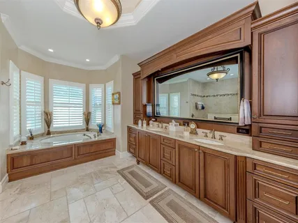 a bathroom with a tub and a view of bathroom