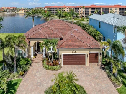 a view of a house with flower plants
