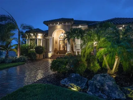 a view of a porch with a ocean from a window
