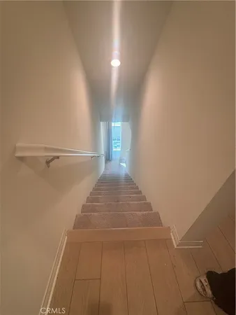 a view of a hallway with staircase