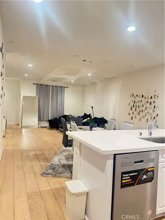 a kitchen with a sink appliances and cabinets