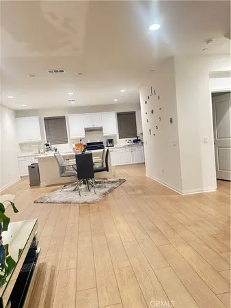 a view of kitchen with refrigerator sink and cabinets