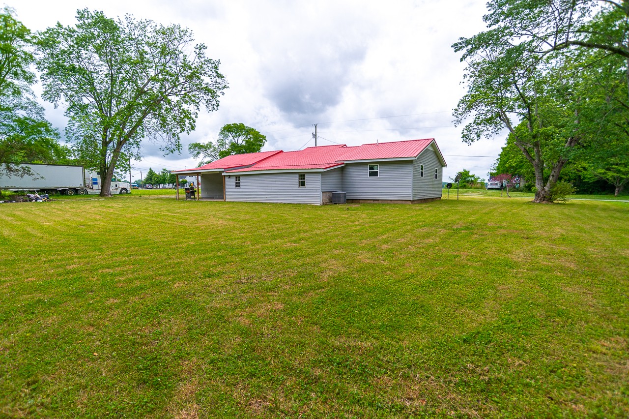 5 Layman Road Elora, TN 37328 - Photo 2 of 29 a backyard of a house with yard and outdoor seating