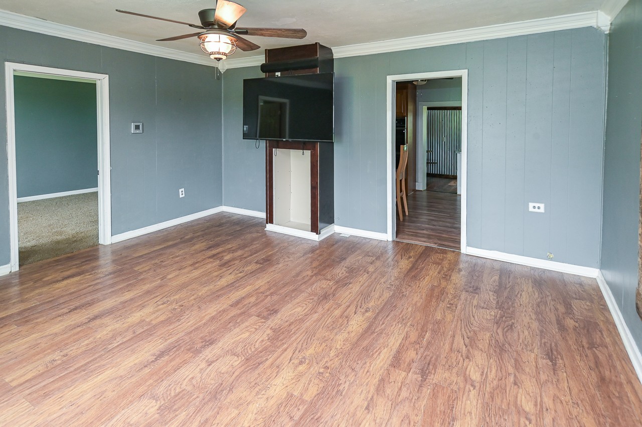 5 Layman Road Elora, TN 37328 - Photo 5 of 29 wooden floor in an empty room with a window