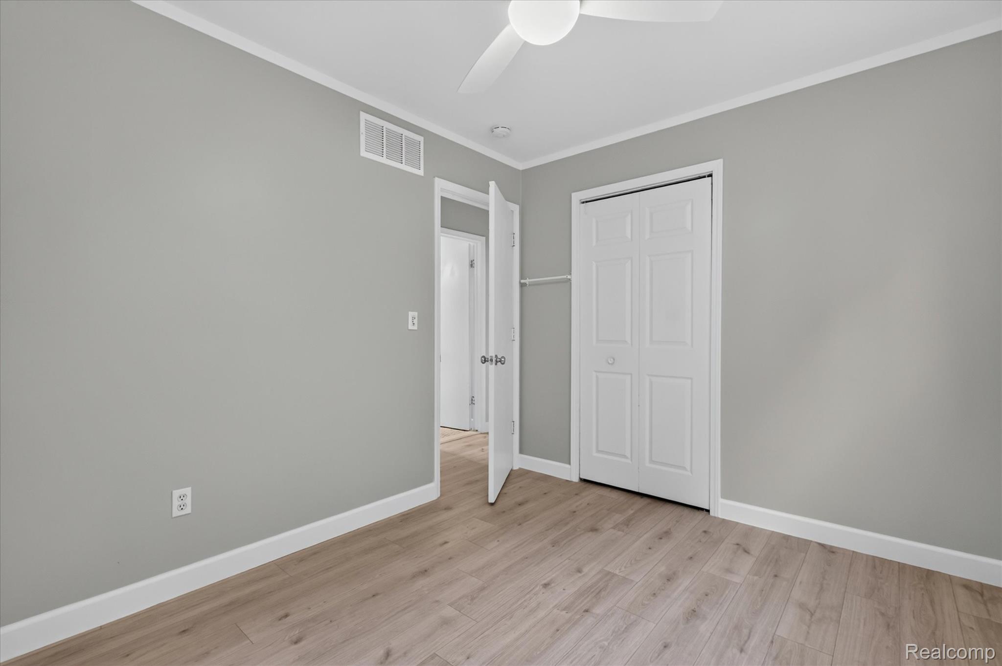934 Harvard Road Berkley, MI 48072 - Photo 27 of 34 Light wood-finish flooring complements the neutral wall color