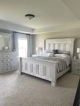 a spacious bathroom with a double vanity sink and a mirror