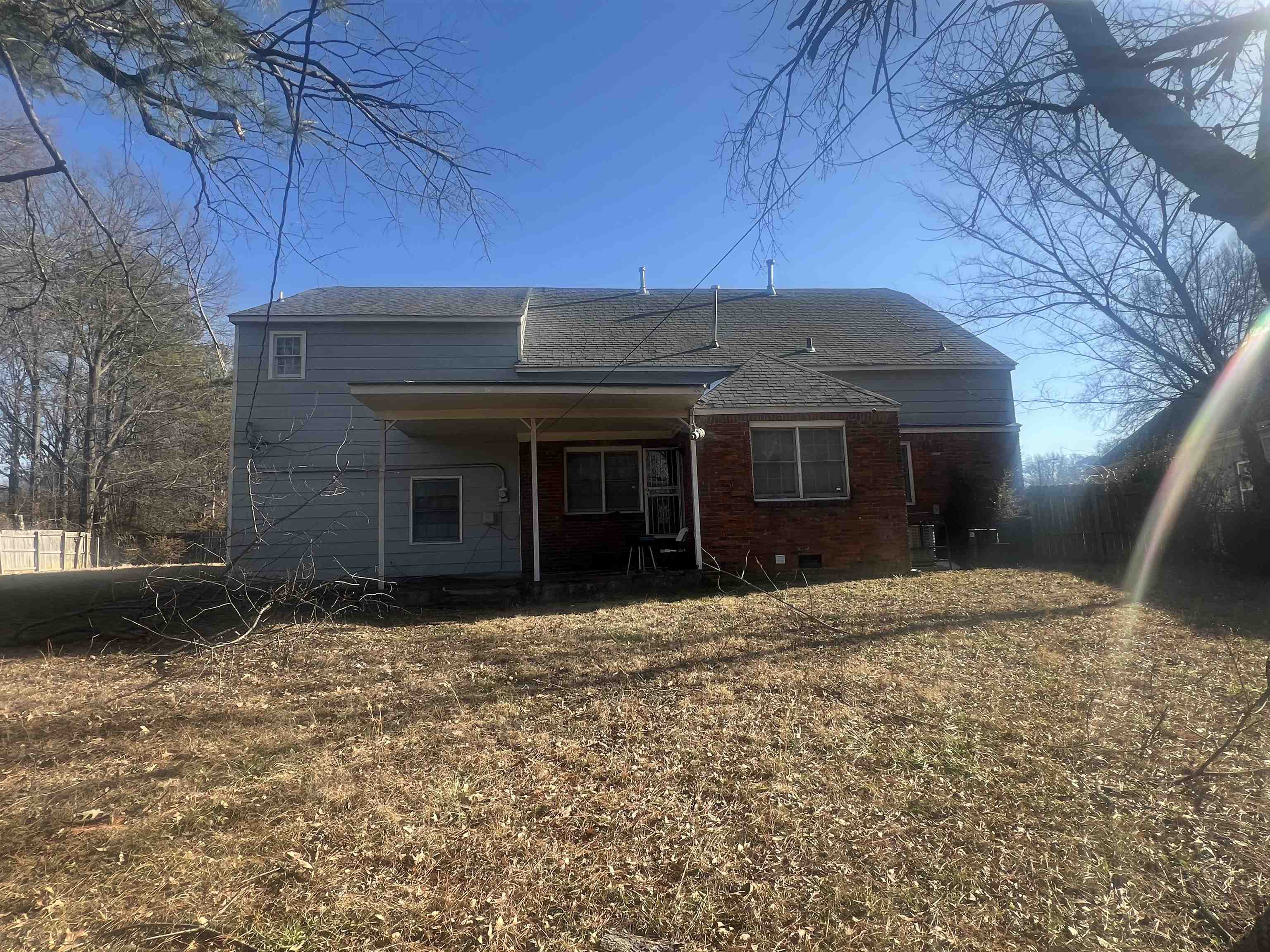 4295 Hudgins Road Memphis, TN 38116 - Photo 4 of 13 a front view of a house with a yard