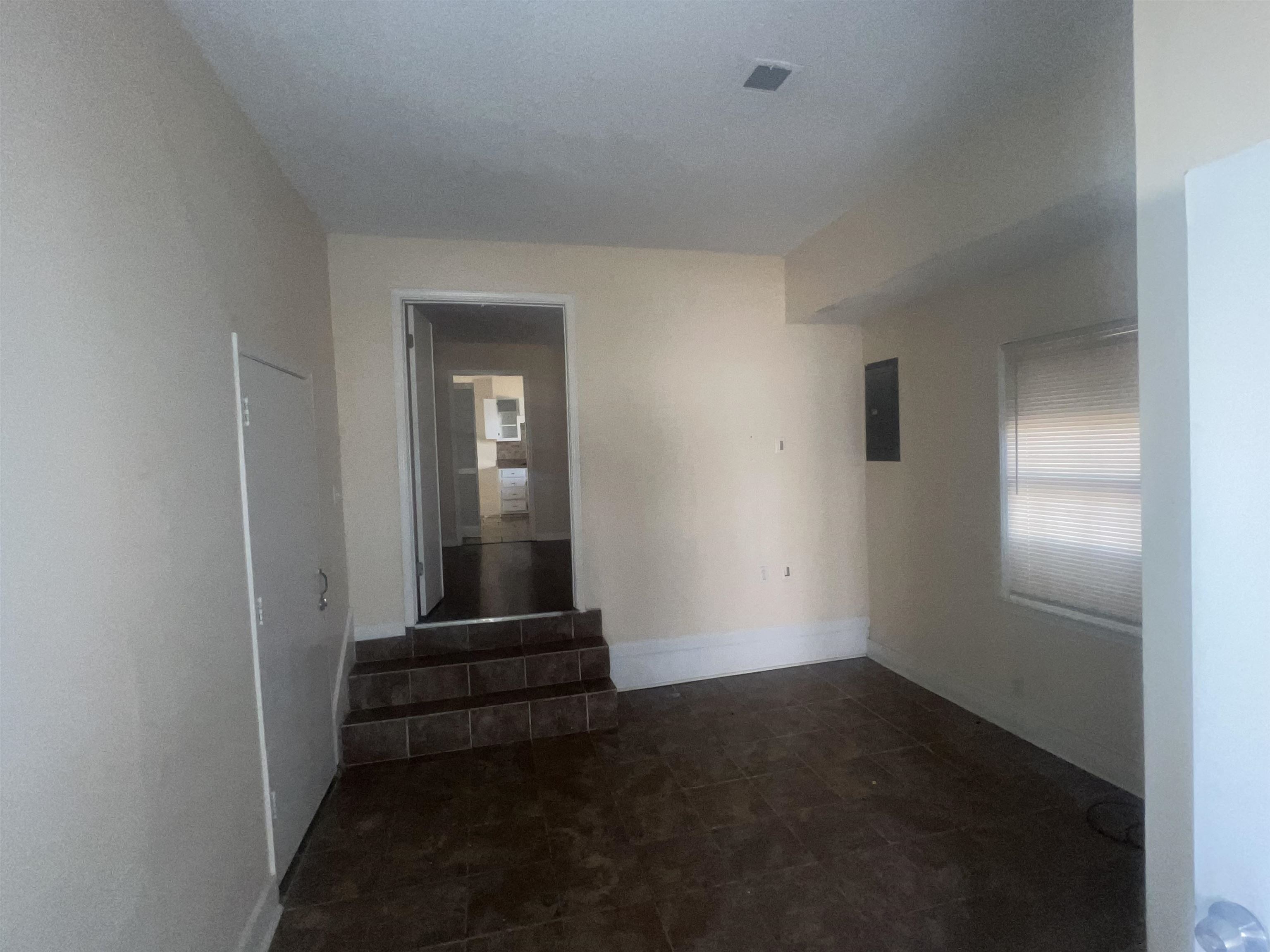 4295 Hudgins Road Memphis, TN 38116 - Photo 8 of 13 a view of a livingroom with wooden floor and a window