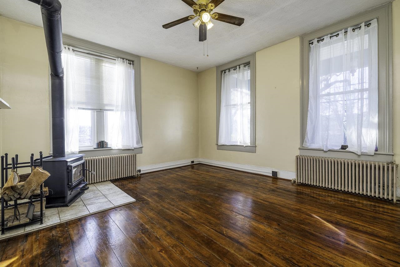289 Brocks Gap Road Broadway, VA 22815 - Photo 12 of 46 a view of an empty room with wooden floor and a window
