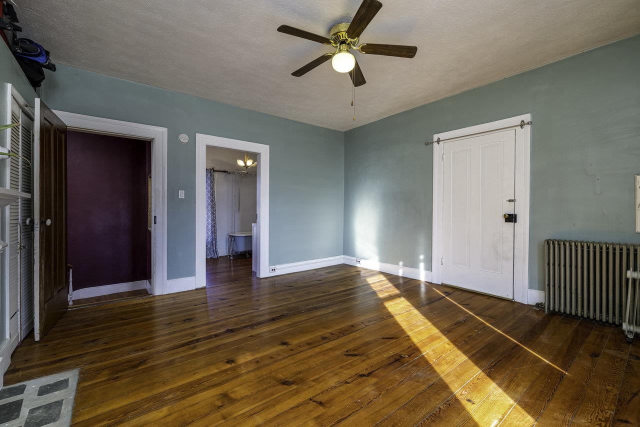289 Brocks Gap Road Broadway, VA 22815 - Photo 19 of 46 a view of a livingroom with wooden floor and a ceiling fan