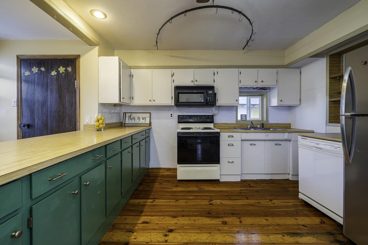 289 Brocks Gap Road Broadway, VA 22815 - Photo 2 of 46 a kitchen with stainless steel appliances granite countertop a sink cabinets and a wooden floor