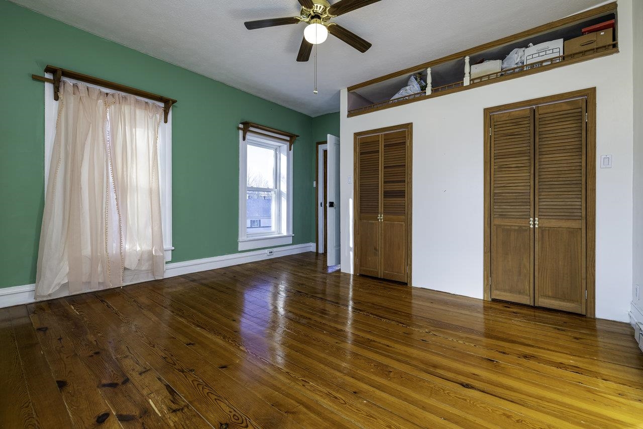 289 Brocks Gap Road Broadway, VA 22815 - Photo 23 of 46 an empty room with wooden floor cabinet and windows