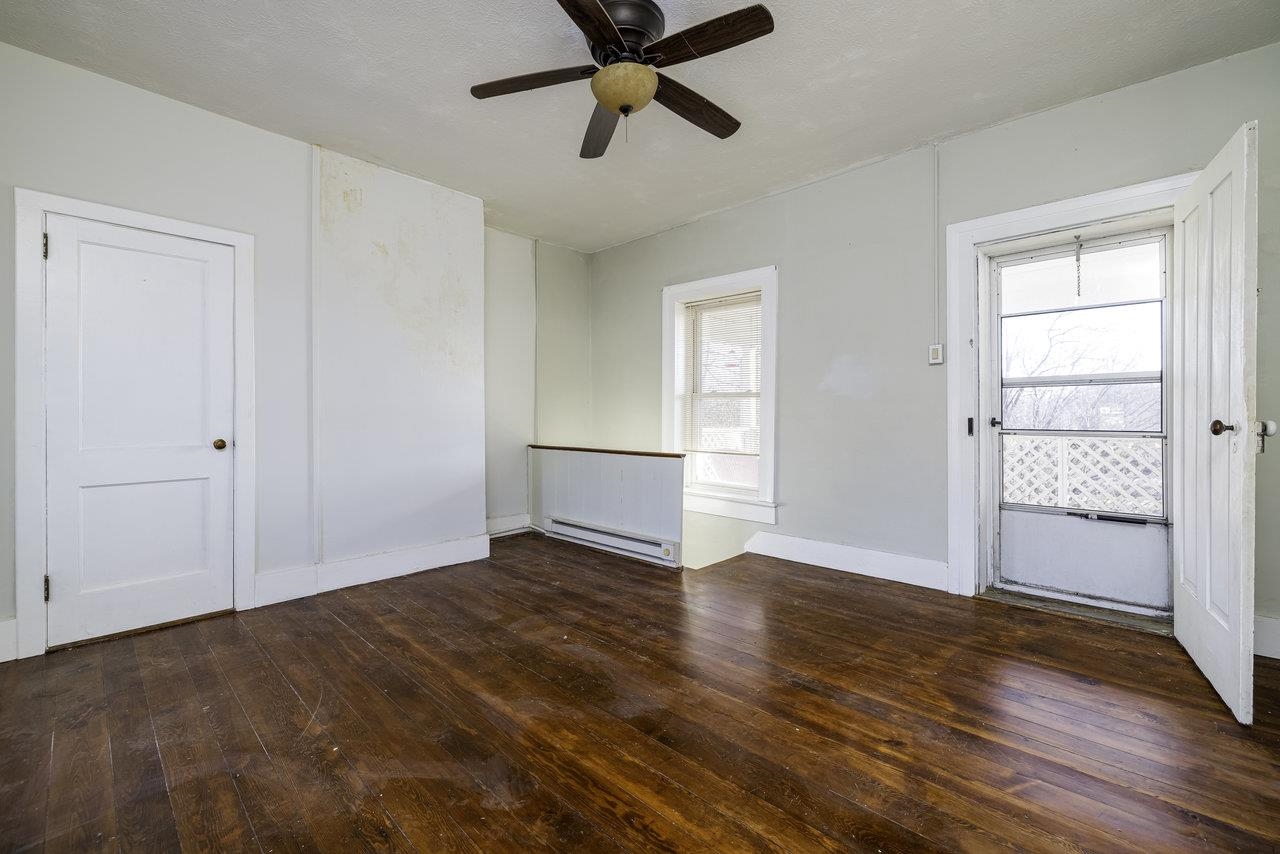 289 Brocks Gap Road Broadway, VA 22815 - Photo 25 of 46 an empty room with wooden floor and windows