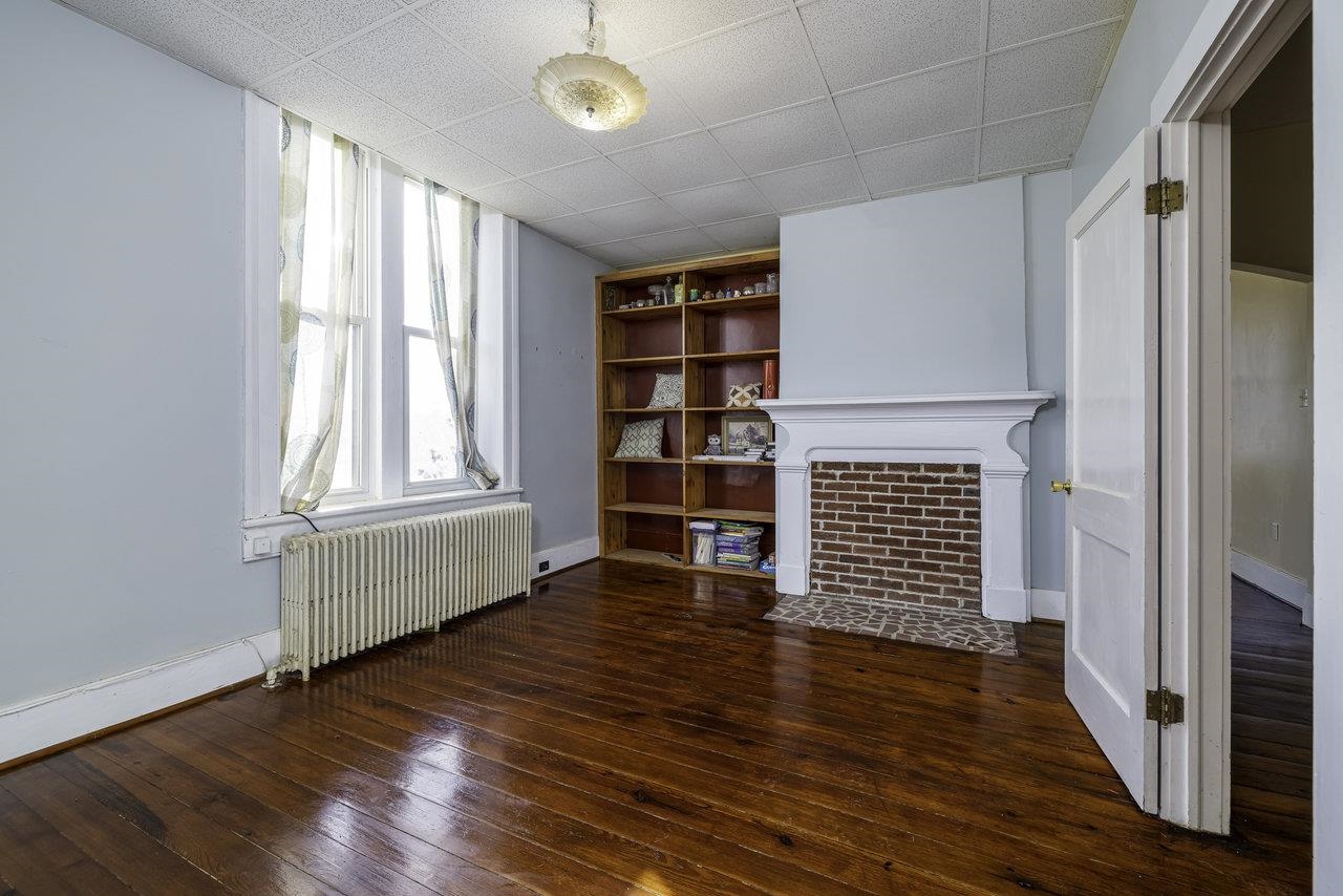 289 Brocks Gap Road Broadway, VA 22815 - Photo 10 of 46 an empty room with wooden floor and windows