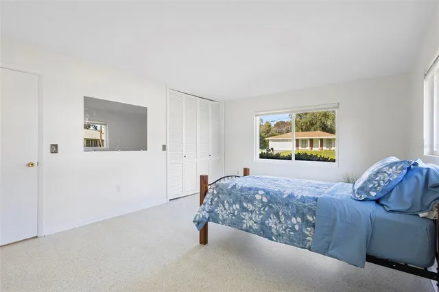 a view of hallway with furniture and a window