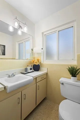 a patio with a patio table and chairs