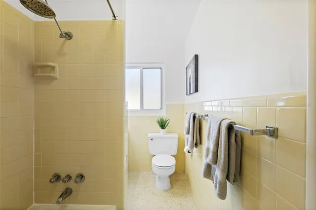 a view of a chairs and table in patio with a fire pit